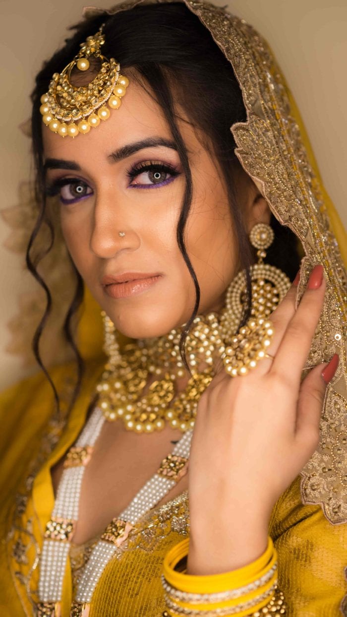 Bride With yellow lehenga and golden jewels