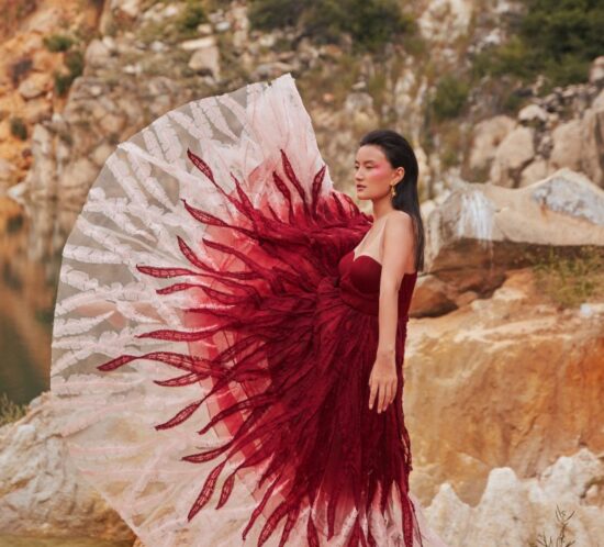 Model posing with red gown