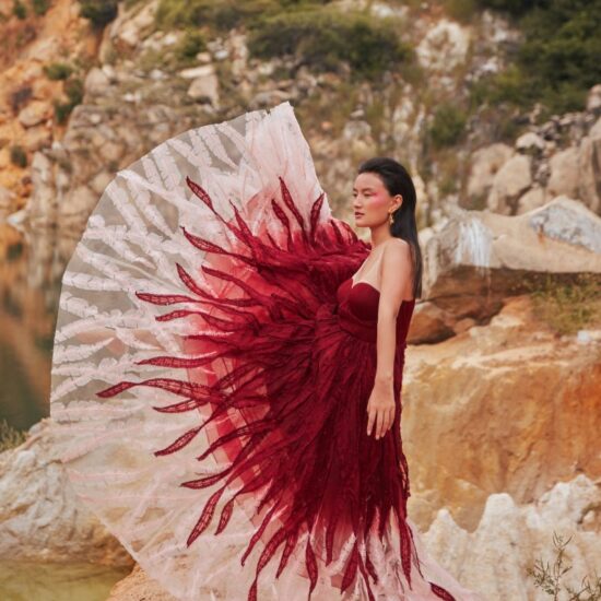 Model posing with red gown