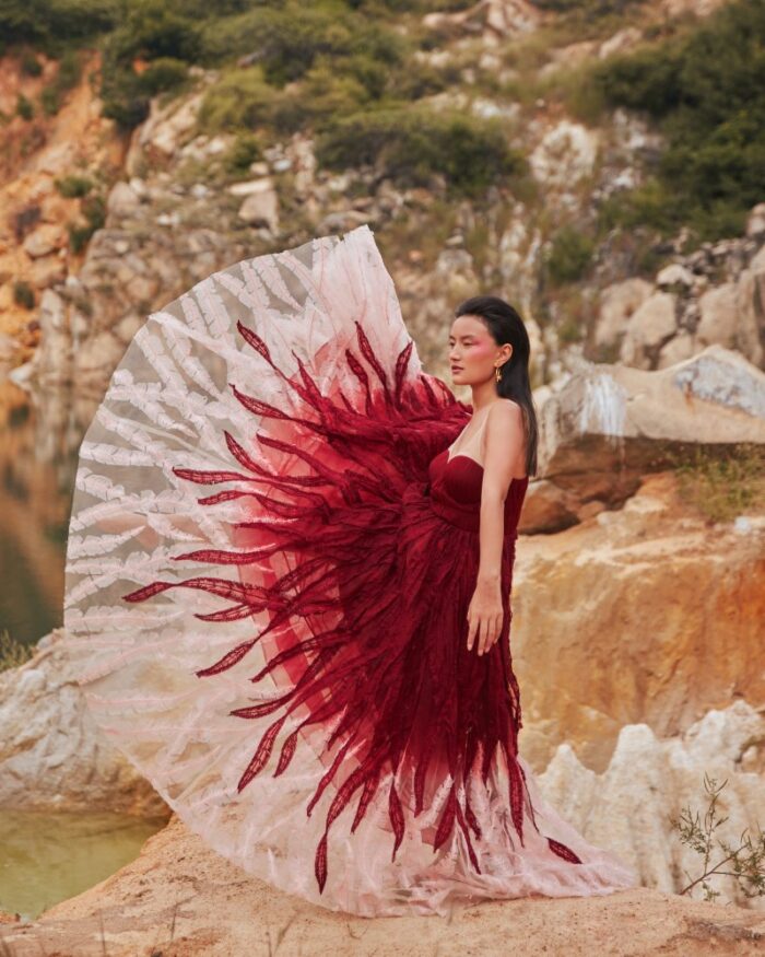Model posing with red gown